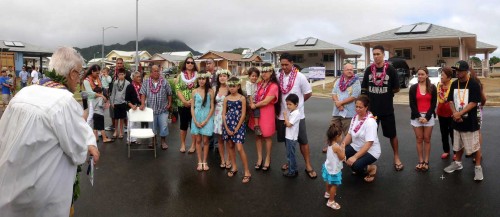 The six new Kumuhau homestead 'ohana gather for a final blessing from Kahu Bill Kaina before the ceremonial untying of the maile lei at this morning's ceremonies.