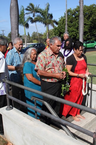 Hawaiian Homes Commission Chair Jobie Masagatani and Deputy to the Chair Bill Aila Jr. present ho'okupu before entering the crypt at the Mauna'ala Royal Mausoleum in Nu'uanu. PHOTO CREDIT: Phil Spalding.